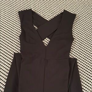 Black cris-cross back jumpsuit with flared hem and back zipper